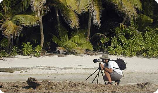 Chris Johnson taking photographs on a remote island in the Indian Ocean